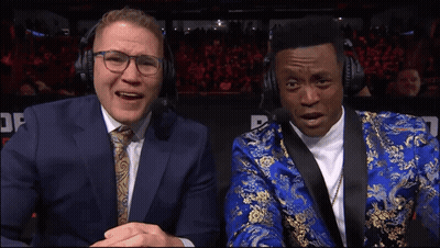 Man In Blue Suit Next To Man In Blue And Gold Suit GIF