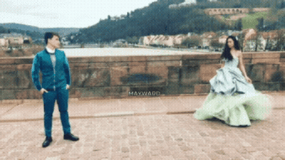 Man In Blue Suit Next To Woman In Green Dress Mayward GIF