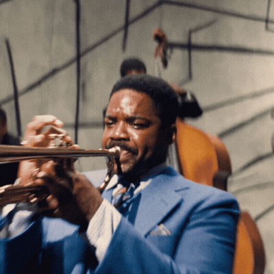 Man In Blue Suit Playing Trumpet GIF