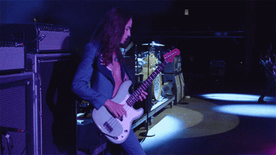 Man In Blue Suit Playing White Guitar GIF