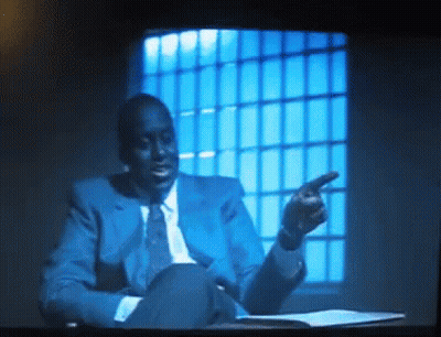 Man In Blue Suit Pointing GIF