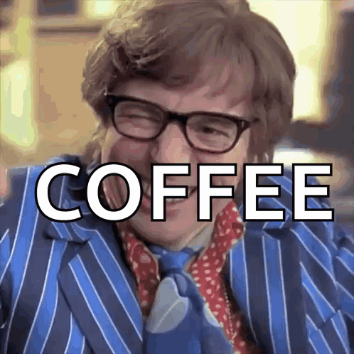 Man In Blue Suit Saying Coffee GIF
