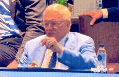 Man In Blue Suit Sitting Before GIF Maker Button GIF
