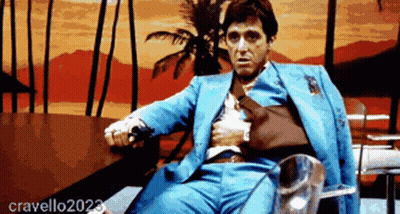 Man In Blue Suit Sitting By Palm Tree GIF
