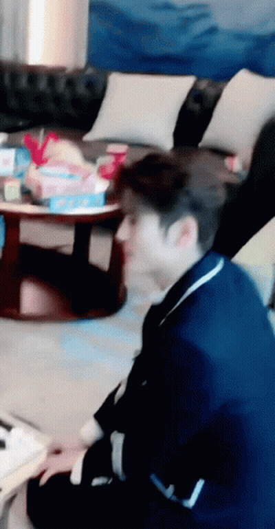Man In Blue Suit Sitting On Floor GIF