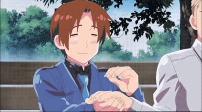 Man In Blue Suit Smiling And Holding Hand GIF