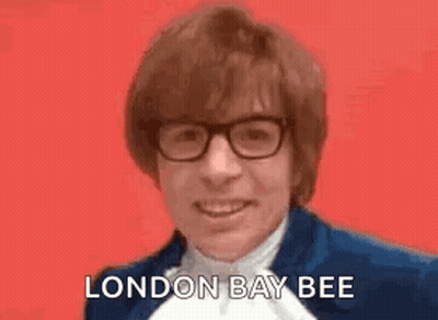Man In Blue Suit Smiling Saying London Bee GIF