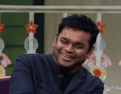 Man In Blue Suit Smiling With A GIF