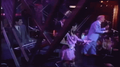 Man In Blue Suit Standing Next To Woman On Stage Saying Leave No Trace GIF