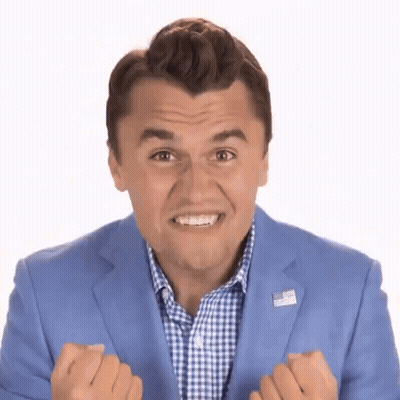 Man In Blue Suit With American Flag Pin Making Funny Face GIF
