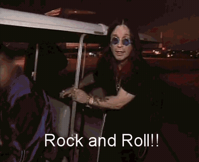 Man In Blue Sunglasses And Black Shirt Says Rock And Roll GIF