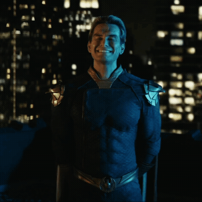Man In Blue Superhero Costume Smiling GIF