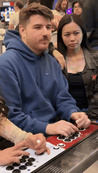 Man In Blue Supreme Hoodie Playing Video Game GIF