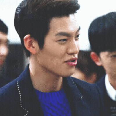 Man In Blue Sweater And Jacket In Crowd GIF