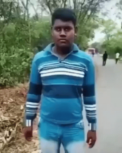 Man In Blue Sweater And Jeans On Road GIF