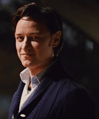 Man In Blue Sweater And White Shirt Smiling GIF