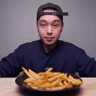 Man In Blue Sweater Deen Eating French Fries GIF