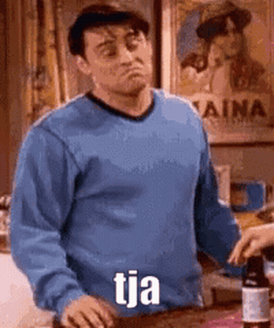 Man In Blue Sweater Holding Wine Says Tja GIF