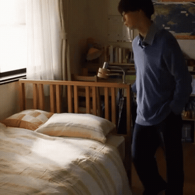 Man In Blue Sweater In Bedroom GIF