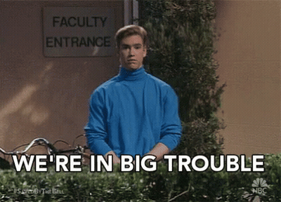 Man In Blue Sweater In Front Of Faculty Entrance Sign GIF