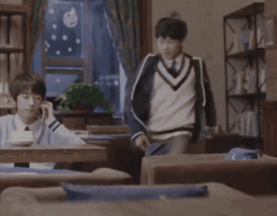 Man In Blue Sweater Kicking Another Man GIF