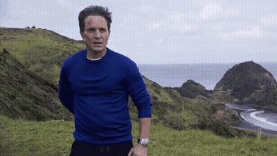 Man In Blue Sweater Overlooking Ocean GIF