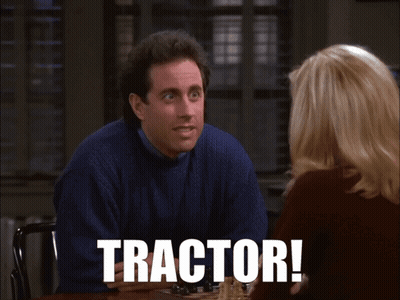 Man In Blue Sweater Sitting With Woman Tractor On Screen GIF
