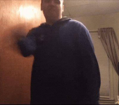Man In Blue Sweater Standing GIF