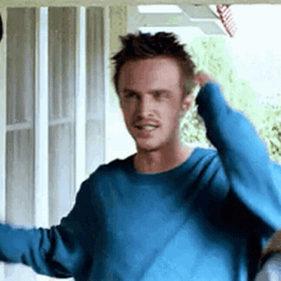 Man In Blue Sweater Standing Before Screen Door GIF