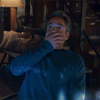 Man In Blue Sweater Standing With Hands Up GIF