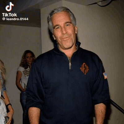 Man In Blue Sweater With Monogram GIF