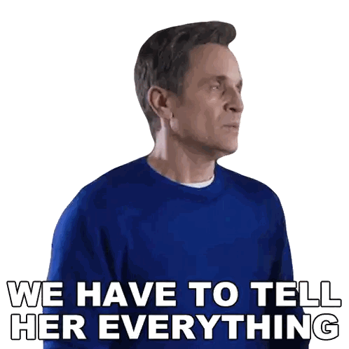 Man In Blue Sweater With We Have To Tell Her Everything Sticker