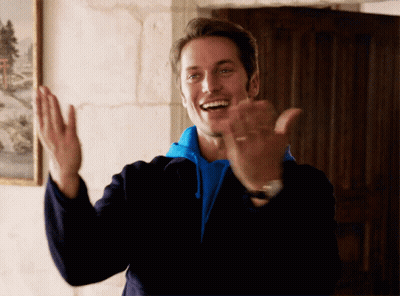 Man In Blue Sweatshirt And Black Jacket Applauds GIF