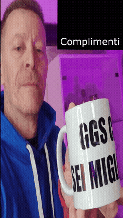 Man In Blue Sweatshirt Holding Mug Saying Complimenti GIF