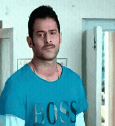 Man In Blue T-Shirt Saying Boss Standing In Front Of Door GIF