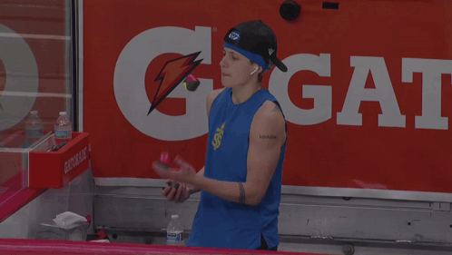 Man In Blue Tank Top In Front Of Gatorade Sign GIF