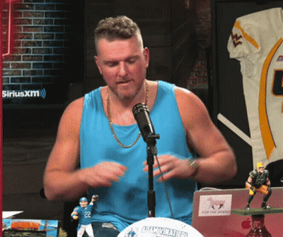 Man In Blue Tank Top Sitting At SiriusXM Logo GIF