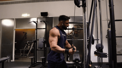 Man In Blue Tank Top Working Out GIF