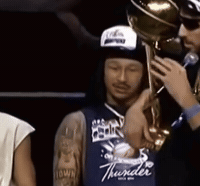 Man In Blue Thunder Jersey Holding Trophy GIF