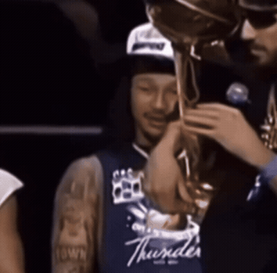 Man In Blue Thunder Jersey Holding Trophy GIF