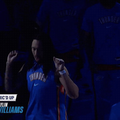 Man In Blue Thunder Jersey In Front Of Williams Sign GIF