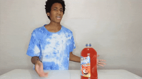Man In Blue Tie Dye Shirt With K-Cups GIF