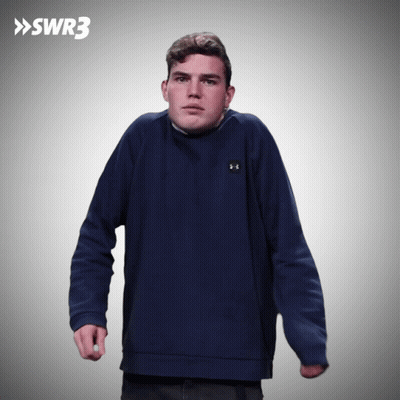 Man In Blue Under Armour Sweatshirt In Front Of SWR3 Sign GIF
