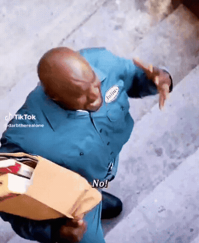 Man In Blue Uniform Holding Envelope Saying No GIF