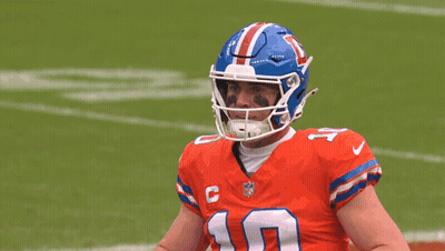 Man In Blue Uniform With Medal And Cross GIF