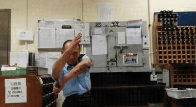 Man In Blue Uniform With Sign Saying 10 GIF