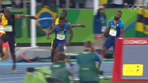 Man In Blue USA Shirt Running On Track GIF