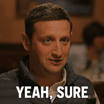Man In Blue Vest Saying Yeah Sure GIF