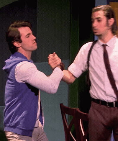 Man In Blue Vest Shaking Hands With Man In White Shirt And Tie GIF