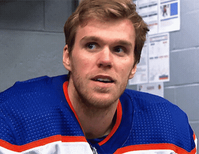 Man In Blue, White, And Orange Hockey Jersey GIF